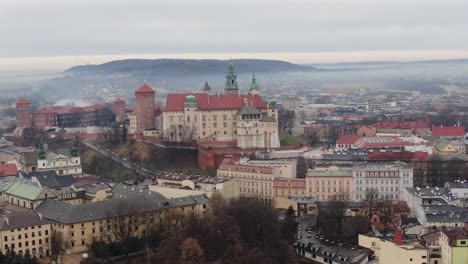 Historical-royal-residence-Wawel-castle-revealing-from-morning-mist,-Krakow-Poland