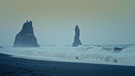 Breathtaking-view-of-big-rough-waves-crushing-on-the-shore-of-Reynisfjara-beach-in-Iceland