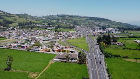 Aerial-road-highway-network-near-junction,-normal-traffic-conditions-Ecuador