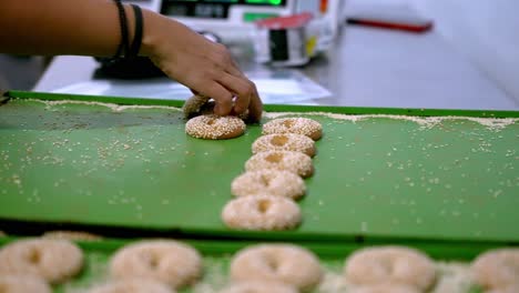 Production-line-of-women-hands-making-cookies