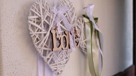 Wooden-woven-heart-decorates-a-wall-for-wedding-ceremony