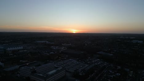 Bury-st-edmunds,-england-at-dusk-with-cityscape-and-sunset,-aerial-view
