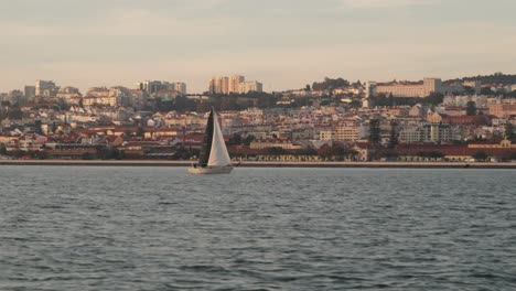 Sailing-Across-The-Coastal-Town-Of-Lisbon,-Portugal