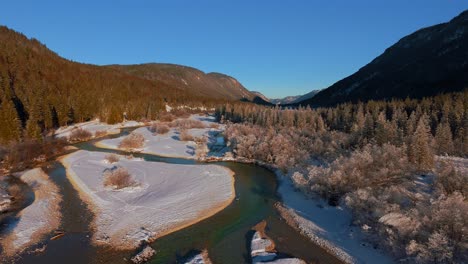 Isar-mountain-river-in-Bavarian-alps,-winter-snow-forest
