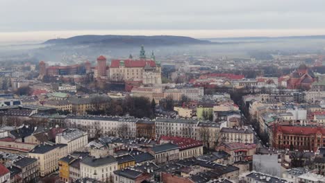 Aerial-panorama-of-Krakow-with-royal-Wawel-castle-on-misty-autumn-morning