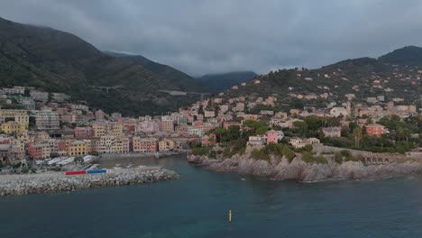 Genoa-nervi-coast-with-colorful-buildings-at-dusk,-aerial-view