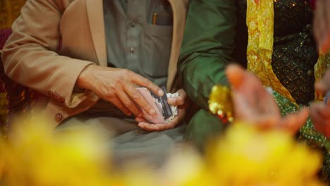 Close-up-of-a-money-gift-to-a-wedding-couple-in-Pakistan-during-a-wedding