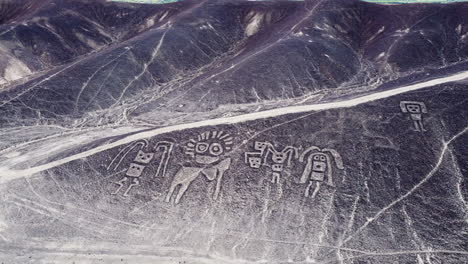 Aerial-view-of-mysterious-humanoid-creatures-and-the-Nazca-lines-in-the-peruvian-desert