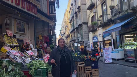 Local-fruit-vendor-woman-tending-to-her-street-fruit-business-in-Naples