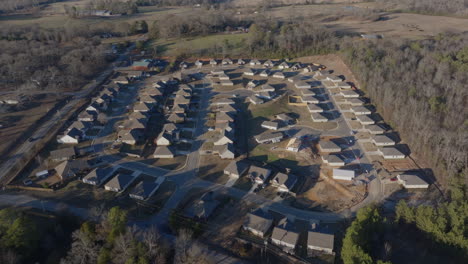 Aerial-footage-flying-over-a-suburban-neighborhood-in-Lincoln,-Alabama,-showcasing-the-layout-and-serene-environment-of-the-area
