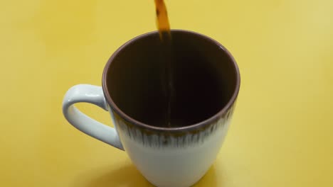Freshly-Brewed-Coffee-Pouring-Into-Mug.-closeup-shot