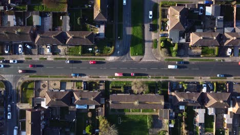 Overhead-View-Cars-Driving-Through-Road-In-Grimsby-Town,-Lincolnshire,-England---aerial-shot