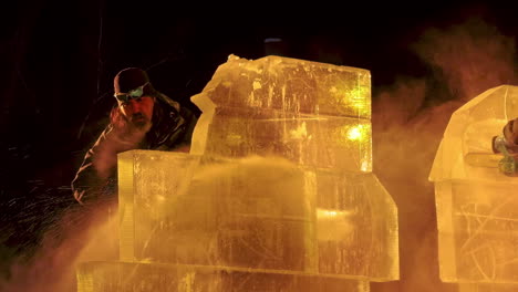 Ice-sculptor-crafting-ice-sculptures-under-night-lights