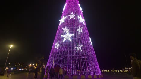 Illuminated-Christmas-Tree-Changing-Colors-At-Night-In-Madeira-Island,-Portugal