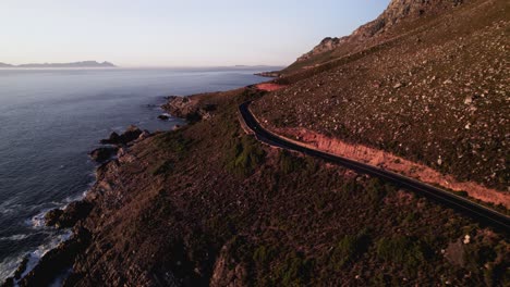 Sunset-coast-line-motorcycle-rides,
Drone-view-of-winding-scenic-road
