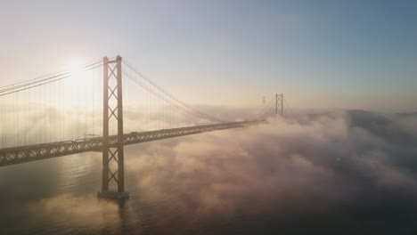 Ponte-25-de-Abril,-Suspension-Bridge-Over-Tagus-River-On-A-Foggy-Morning-In-Lisbon,-Portugal