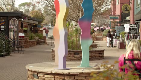 Colorful-sculpture-in-downtown-Sedona,-Arizona-with-video-tilting-down