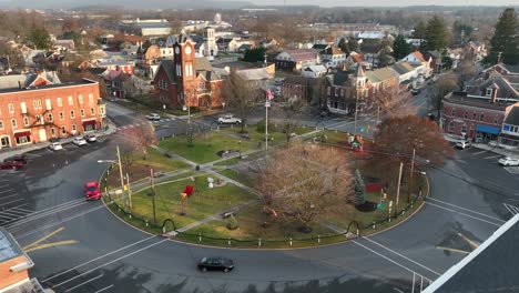 Aerial-establishing-shot-of-American-flag-in-center-of-roundabout