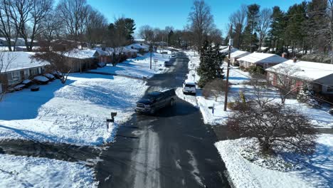 Aerial-view-of-pickup-truck-backing-out-of-suburban-driveway