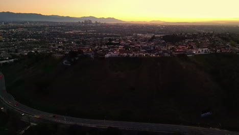 Panoramic-Los-Angeles-city-view-at-sunset-from-Kenneth-Hahn-lookout,-aerial