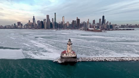 Aerial-view-away-from-the-Chicago-Harbor-Lighthouse-with-Ice-fog-on-lake-Michigan