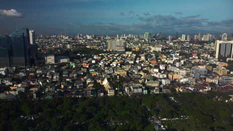 Aerial-overview-of-the-Olympia-Barangay,-sunny-evening-in-Makati,-Philippines