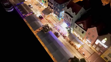 Aerial-top-down-overview-of-Handelskade-buildings-lit-at-night-in-evening
