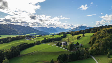 The-Austrian-countryside-with-the-alps-and-the-Attersee-Lake-in-the-distance---aerial-hyperlapse