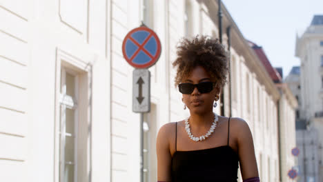 Young-fashionable-african-woman-walking-down-the-street