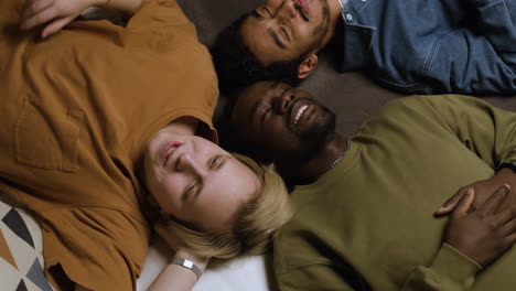 Group-of-men-laying-on-the-bed