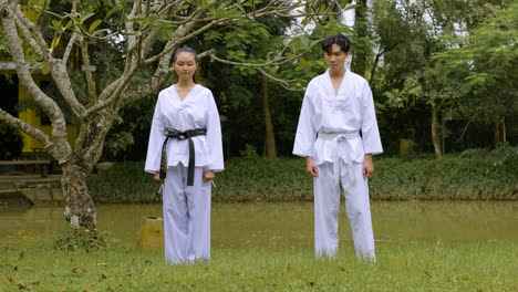 Young-couple-getting-ready-for-taekwondo