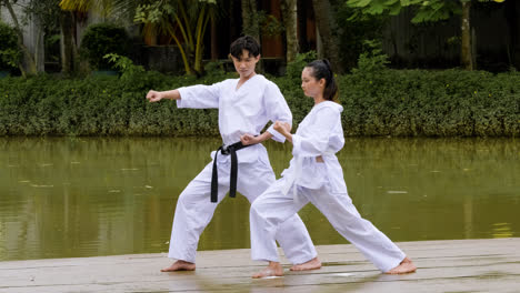 Man-teaching-martial-arts-to-young-student