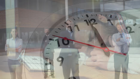 Animation-of-ticking-clock-over-portrait-of-diverse-businesspeople-crossing-arms-standing-at-office