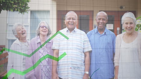 Animation-of-graphs-with-changing-numbers-over-smiling-diverse-senior-friends-standing-against-house