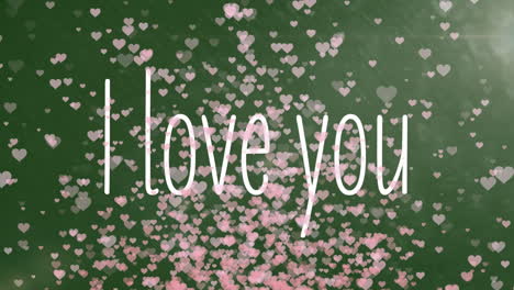 Animation-of-i-love-you-text-with-pink-heart-shapes-flying-on-green-background