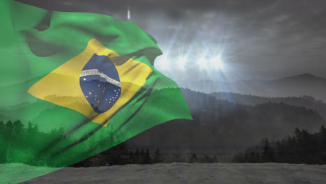Animation-of-waving-flag-of-brazil-over-scenic-view-of-trees-and-mountains-against-lights