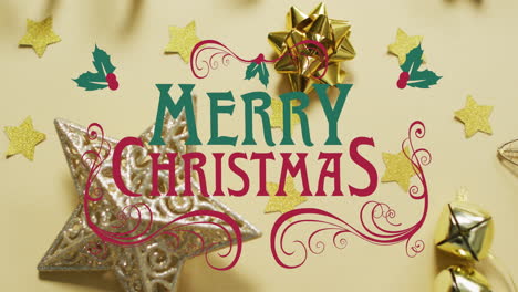 Animation-of-merry-christmas-text-and-christmas-decorations-on-table