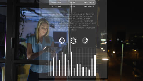 Animation-of-data-processing-over-caucasian-woman-using-tablet-while-working-late-at-office