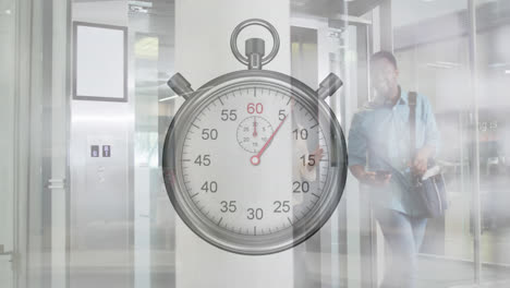 Animation-of-ticking-stopwatch-over-diverse-man-and-woman-discussing-while-walking-out-of-elevator
