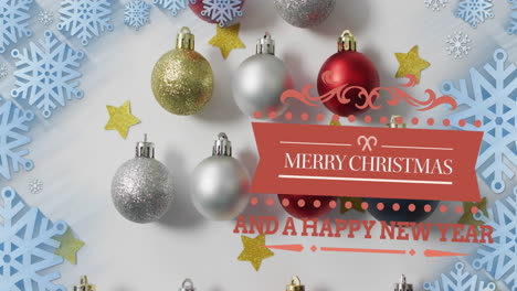 Animation-of-merry-christmas-and-happy-new-year-text-over-snowflakes,-stars-and-baubles