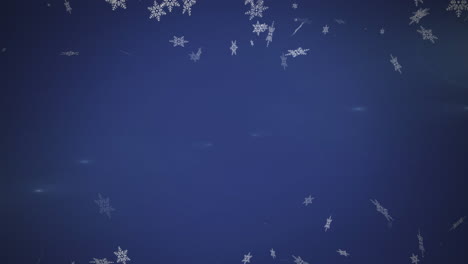 Animation-of-snowflake-icons-floating-against-copy-space-on-blue-background