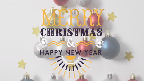 Animation-of-merry-christmas-and-happy-new-year-text-with-christmas-decorations-on-table
