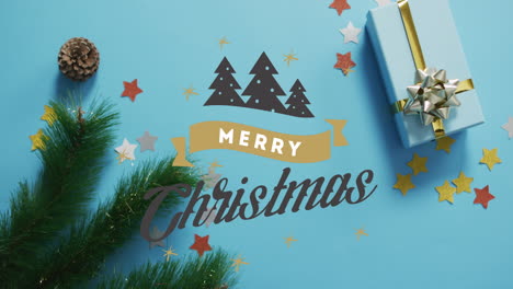 Animation-of-merry-christmas-text-and-christmas-trees-over-decorations-and-gift-box