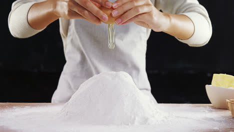 Woman-adding-egg-white-into-flour-4k