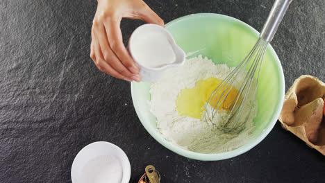 Woman-mixing-milk-in-flour-4k