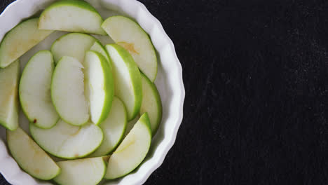 Slice-of-green-apple-on-bowl-4k