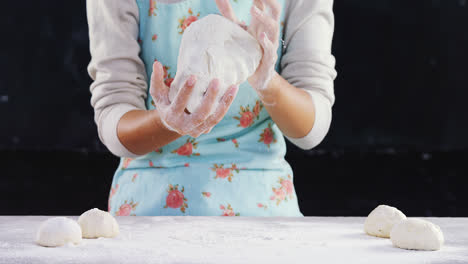 Woman-kneading-a-dough-4k
