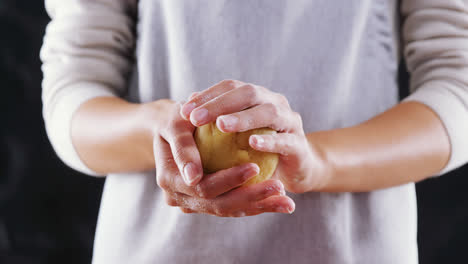 Woman-molding-a-dough-ball-4k