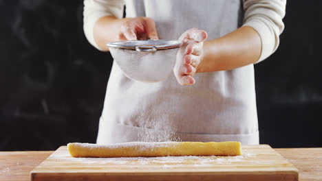 Woman-icing-sugar-on-dough-4k