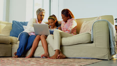 Happy-family-using-laptop-in-living-room-4k